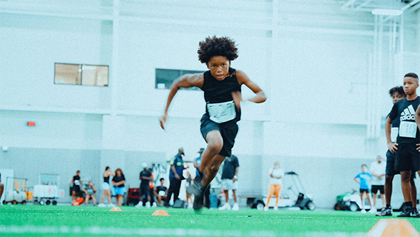 Young athlete sprinting during a combine event